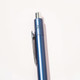 A blue ballpoint pen with a silver clip and a metallic finish, featuring a logo on the side.