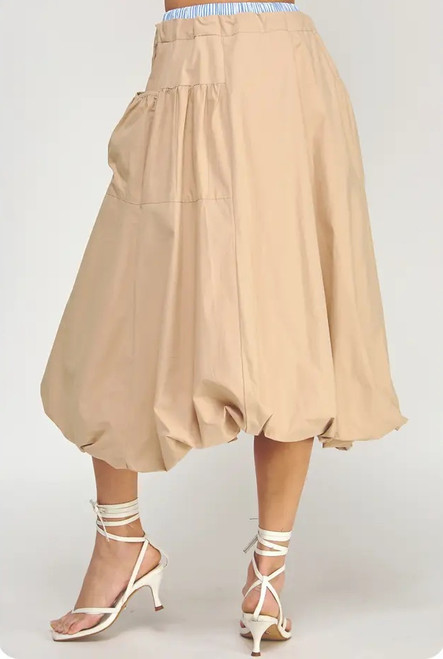 Trick Puff Parachute Skirt, featuring a balloon hem, drawstring waist, and lightweight neutral cotton