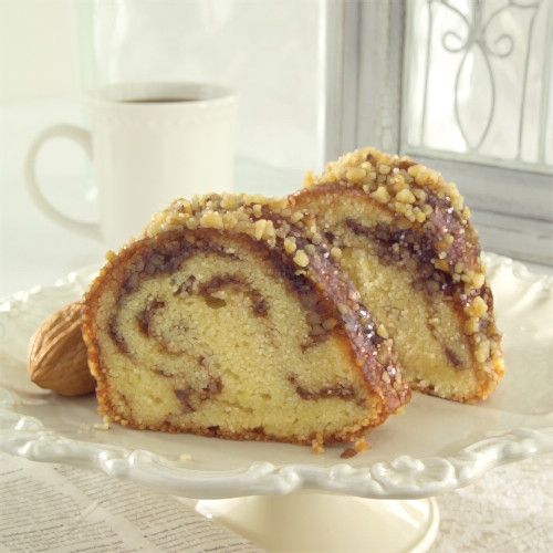 Sandy's Sour Cream Coffee Cake Buttery and full of sour cream, this bundt is ribboned with cinnamon, brown sugar
and nuts, then glazed with apricots.