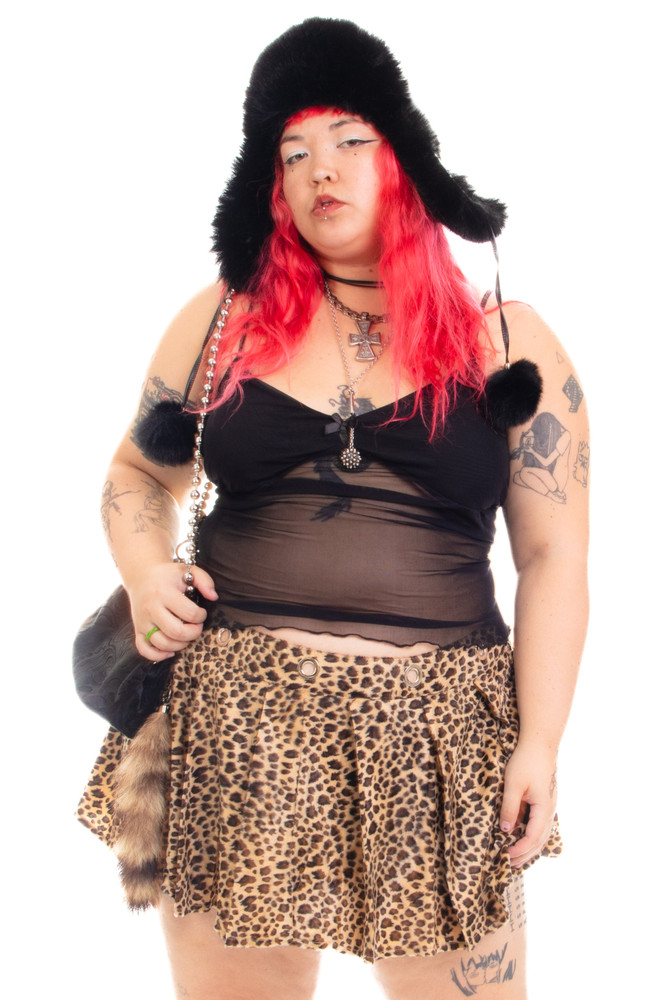 Peekaboo Fuzzy Leopard Print Grommet Mini Skirt