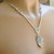 Pewter dipped carob leaf pendant necklace satin