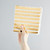 Gold and white striped party paper napkins