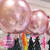 Rose gold orb birthday balloons with black tassel tails delivered to your party inflated with helium