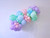 Pastel balloon garland display arch installation for birthday parties and baby showers