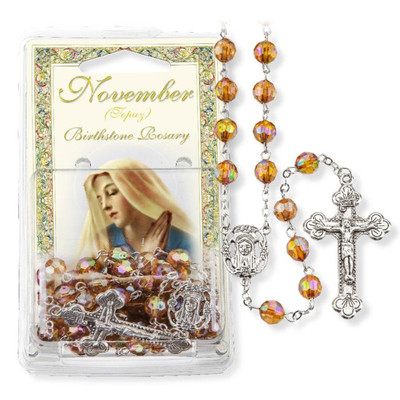 Quality aurora borealis faceted colorful and inexpensive Catholic rosaries. Our beautiful 8 mm Aurora Borealis Faceted Acrylic Birthstone Bead Rosary has a detailed silver oxidized 'Mary' center and stunning crucifix.