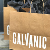A custom kraft paper shopping bag.