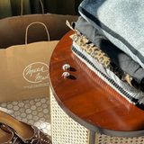A custom kraft paper shopping bag.