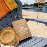 A custom kraft paper shopping bag.