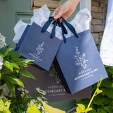 Custom navy blue twill handle euro tote shopping bags in three sizes.