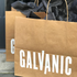 A custom kraft paper shopping bag.