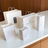 White paper shopping bags in a variety of sizes