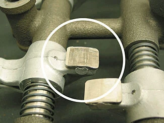 Severely worn 22R/RE rocker arm wear pad