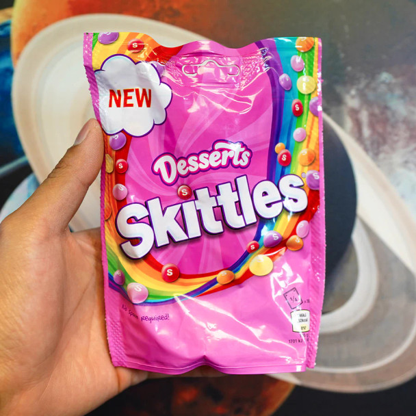 Skittles Desserts - A delightful assortment of unique Skittles candy flavors, including Cherry Cheesecake, Choco-Orange Cake, Blueberry Tart, Lemon Pie, and Strawberry Ice Cream. Perfect for those who love dessert-inspired treats, available now at VapeRaiders.com.