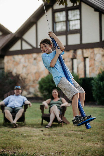 Air Pogo XTREME Blue 2-Piece - Boy on Air Pogo with Family in Background