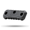 Single black MDT M-LOK exterior forend weight from a 2-pack set, model 107304-BLK, designed for rifle balance customization. This weight showcases an angular, beveled design with multiple mounting holes, including an M-LOK compatible system. The engraved MDT logo is prominent on the contoured surface, which is set against a blurred white background, accentuating the weight's rugged functionality.