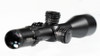 Element Optics Titan 5-25x56 FFP rifle scope with an APR-2D MOA reticle is prominently displayed in this image. The scope boasts a sleek black finish and precision etched MOA graduations on both the elevation and windage turrets, indicating its suitability for fine-tuned adjustments. The scope's eyepiece shows a multi-coated lens with light reflecting off the surface, suggesting high-quality optics with excellent light transmission. The focus is on the scope's tactical and precision features, set against a blurred white background that draws attention to the equipment's details. This image would serve well in showcasing the scope's high-end features for outdoor enthusiasts, hunters, and marksmen looking for an optic that combines functionality, durability, and advanced optical performance.