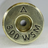 The image shows a close-up view of a cartridge case head with the marking "300 WSM," which stands for .300 Winchester Short Magnum. The "A" likely represents the manufacturer, Atlas Development Group. The presence of the term "Anneal Line" indicates that this brass has undergone annealing, a heat treatment process that softens the brass to extend its life and improve its durability. This treatment is evident from the discoloration around the primer pocket, which is a visual indicator of the annealing process. The "50pc Box" suggests that this type of brass is sold in boxes containing 50 pieces, catering to shooters and reloaders who require high-quality components for precision shooting. The .300 WSM is a popular choice for hunting and long-range shooting due to its high ballistic performance in a more compact cartridge than the original .300 Winchester Magnum.