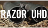 The image features what appears to be a pair of Vortex Optics RAZOR UHD (Ultra High Definition) binoculars, presumably with an 18x56 specification. This means they likely offer 18x magnification with a 56mm objective lens diameter. The "Full-Size Roof Prism" designation indicates they use a roof prism design, which is known for creating a more compact and streamlined shape compared to Porro prisms, making them preferred for high-end optics. These binoculars are designed for very detailed, high-resolution observation over long distances, which can be essential for activities like hunting, birdwatching, or any serious observation needs where clarity and detail are paramount.