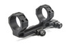 In this image, you've shared a different angle of the Geissele Automatics Super Precision 34mm Scope Mount in black. This angle provides a clearer view of the side profile, showcasing the mount's clamping mechanism and the bolts used for securing it to a firearm's rail system. The precision cut-outs and the matte black finish highlight the attention to detail in the design, aimed at combining functionality with a sleek appearance. Such mounts are essential for ensuring the stability of the optic, which is critical for accurate shooting in various scenarios, from competitive shooting to tactical operations. Geissele's reputation for quality is evident in the craftsmanship of this mount.