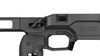 In this detailed image, you can see the MDT ACC Elite Chassis System for the Remington 700, highlighting the grip area and part of the magazine well. The texture on the grip ensures a secure hold, while the design is ergonomic to fit the shooter’s hand comfortably. Just above the grip is the MDT logo, denoting the brand. The chassis is engineered to accommodate easy magazine insertion and release, and the trigger area is cut out to fit standard and aftermarket triggers. This chassis is part of MDT's lineup designed for precision shooting, offering a combination of comfort, adjustability, and stability.