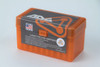 Bright orange plastic ammunition box by Atlas Development Group for 7mm Rem Mag cartridges, featuring a 50-piece capacity. The box is sturdy, designed for secure storage and easy transport of ammunition. The front label includes the Atlas Development Group logo and detailed information about the ammunition specifics, emphasizing the anneal line treatment for enhanced durability. Made in the USA, the label also features a caution symbol and quality assurance badges.
