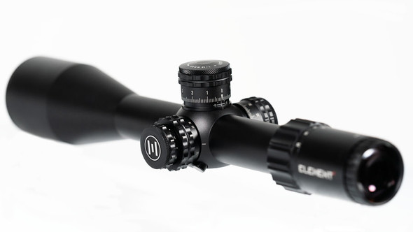 Element Optics, the Titan model with a 5-25x56 FFP magnification and equipped with an EHR-1C MOA reticle. The Titan is a higher-end model in the Element Optics lineup, characterized by its robust construction, precise adjustment turrets, and a large objective lens for superior light gathering. The FFP designation means the reticle scales with the image at different magnifications, which is especially useful for range estimation and holdovers at varying distances. The EHR-1C MOA reticle, while not visible in this image, is designed for enhanced ranging and precision aiming capabilities. The overall design reflects a product built for durability, precision, and functionality for serious shooters.