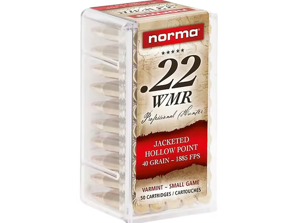 Pack of Norma .22 WMR (Winchester Magnum Rimfire) ammunition with 40 grain Jacketed Hollow Point (JHP) bullets, product number 222410050, containing 50 rounds. The transparent plastic box allows for clear visibility of the shiny brass bullets aligned vertically. The label features red and white colors with details of the ammo's specifications, highlighting its suitability for varmint hunting and target shooting, offering both precision and power.