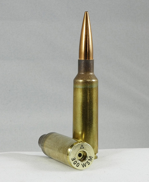 The image shows two rounds of .300 Winchester Short Magnum (WSM) ammunition. The headstamp indicates that these rounds are produced by the Atlas Development Group. Notably, the rounds appear to have an anneal line just above the case head, which is indicative of an annealing process. This process softens the brass to make it more ductile and extend the case life through multiple firings and reloadings. The "50pc Box" annotation suggests that these cartridges are sold in boxes of 50 pieces, which is typical for rifle ammunition. The .300 WSM is a high-powered round that's well-regarded for hunting and long-range precision shooting, offering significant stopping power with a shorter case design than the original .300 Winchester Magnum, which allows it to be used in a lighter, shorter-action rifle.