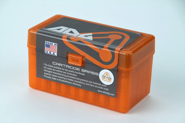 Bright orange ADG Brass hard plastic ammunition box for 338 Remington Ultra Magnum cartridges, prominently displaying the ADG logo and detailed product specifications on the label. The label includes the cartridge type and the quantity (50 pieces), tailored for ammunition collectors and retail presentations.