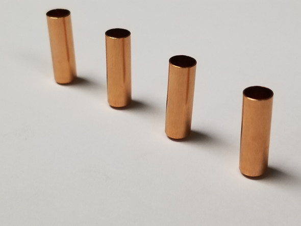 Sierra Jackets, 6mm with a length of .825 inches, quantity 1,000. The image displays five copper bullet jackets arranged neatly on a white background, highlighting their uniform size and precision manufacture. These high-quality jackets are designed for assembling custom bullets used in precision shooting sports, offering excellent consistency and performance.