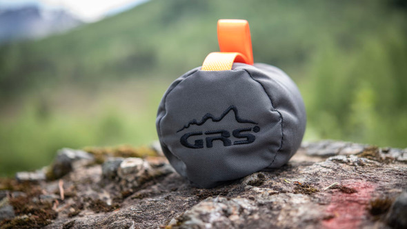 GRS Rear Bag shooting pillow in tan canvas with carabiner hook, isolated on a white background.