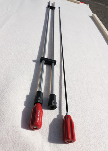 Image of the Benchrite Double Cleaning Rod Case open with two cleaning rods displayed. One rod features a black T-bar handle and metallic shaft, while the other, thinner rod, has a red ergonomic grip. Both are set against a white background, emphasizing their length and build for firearm maintenance.