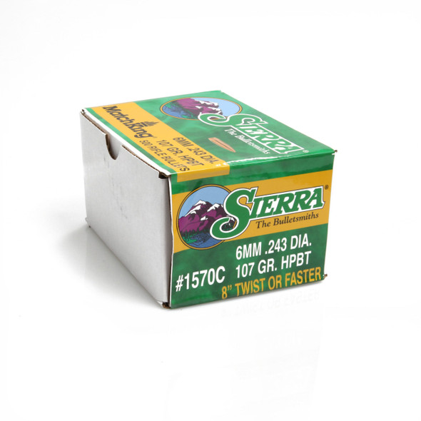 Box of Sierra Bullets, 6mm 107 grain HPBT Match, product number 1570C. The box is green and yellow, featuring the Sierra logo and images of a ram and a bear, with labeling for '6MM .243 DIA. 107 GR. HPBT, 8" twist or faster'. The packaging is designed for bulk purchase, suitable for competitive shooters.