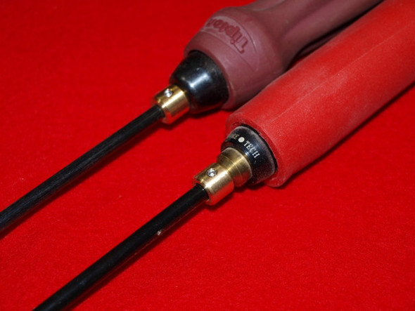 Close-up image of two cleaning rods with Benchrite Rod Case Adapters attached, set against a red velvet background. The adapters connect the rods to the handles, converting 7mm rods for use with .30 caliber firearms, ensuring a precise fit and enhanced stability during maintenance.