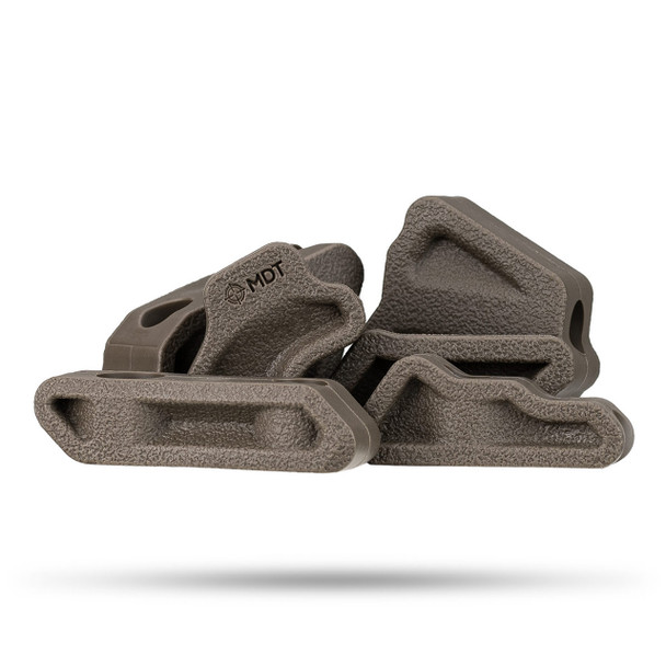 MDT SRS-X Elite Buttstock Dampeners in a tactical flat dark earth (FDE) color (107249-FDE). These high-quality dampeners provide not only a visually appealing contrast to your rifle but also enhance shooting comfort by effectively absorbing recoil. Designed for easy installation, they perfectly complement the SRS-X Elite Buttstock, ensuring a snug and secure fit. Whether you're engaging in long-range shooting or spending hours at the range, these buttstock dampeners are an essential addition for any shooter looking to minimize shoulder fatigue and maintain focus on their target. The MDT logo subtly stamped on each dampener signifies their commitment to quality and compatibility with elite shooting equipment.