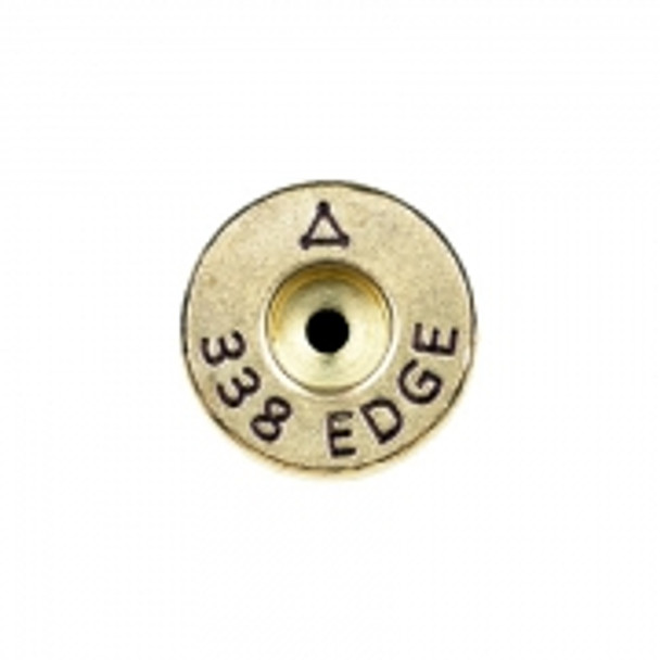Close-up image of the base of a 338 Edge cartridge from ADG Brass, showing the detailed headstamp with '338 EDGE' marking and the central primer hole. The visible anneal line around the cartridge base indicates advanced heat treatment for enhanced durability. Ideal for use in online product displays and for enthusiasts collecting high-performance ammunition in a 50-piece box set.