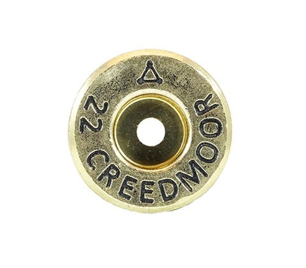 Close-up image of the base of a 22 Creedmoor cartridge from ADG Brass, displaying the engraved headstamp '22 CREEDMOOR'. The brass features a prominent anneal line above the primer, indicative of the heat treatment process to ensure durability. Perfect for showcasing in product listings and appealing to precision shooters and ammunition collectors in a 50-piece box set.