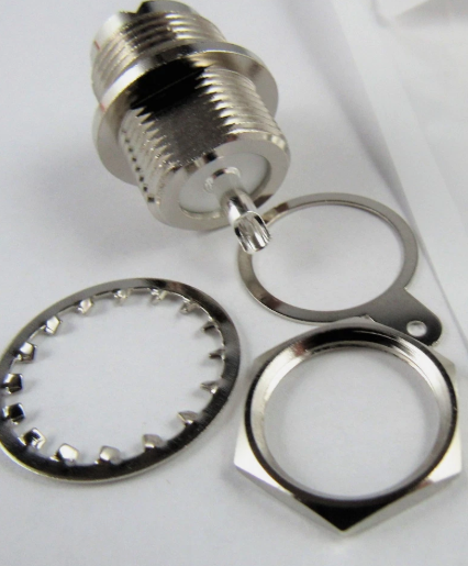 Order the RF Industries UHF female SO-239 single round-hole bulkhead chassis connector. Includes mounting hardware and PTFE dielectric for pass-through installations.