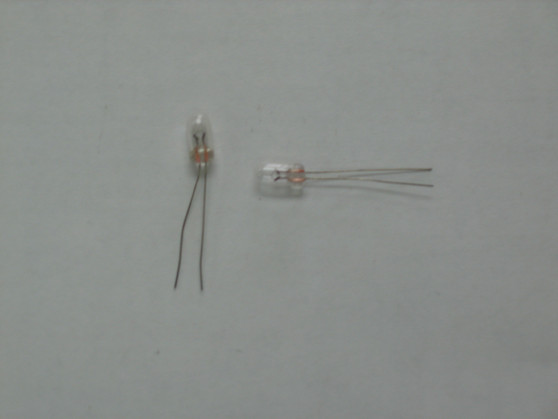 One Base / Mobile Meter Lamp without Orange covers  DX2527 RCI 2950 / 2970 Ect. Normally these come with a orange cover but those are no longer available so you will have to reused your old cover. Notice that there are two lamps in the picture but the price is for one each.