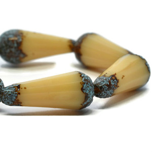 8x15mm Faceted Dangle Drop Beige with an Etched and Picasso Finish and Turquoise Wash Czech Glass Bead Strand 8x15mm Faceted Dangle Drop Beige with an Etched and Picasso Finish and Turquoise Wash Czech Glass Bead Strand