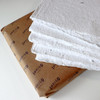 Artway Indigo Seed Paper — deckle-edged cotton rag sheets fanned over the Indigo kraft wrap