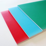 Artway A4 softback sketchbooks fanned in red, blue and green, showing the 135gsm cartridge pages