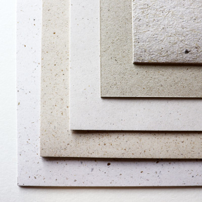 Tree Free paper samples by Artway layered to show range of natural tones from warm beige to cool grey