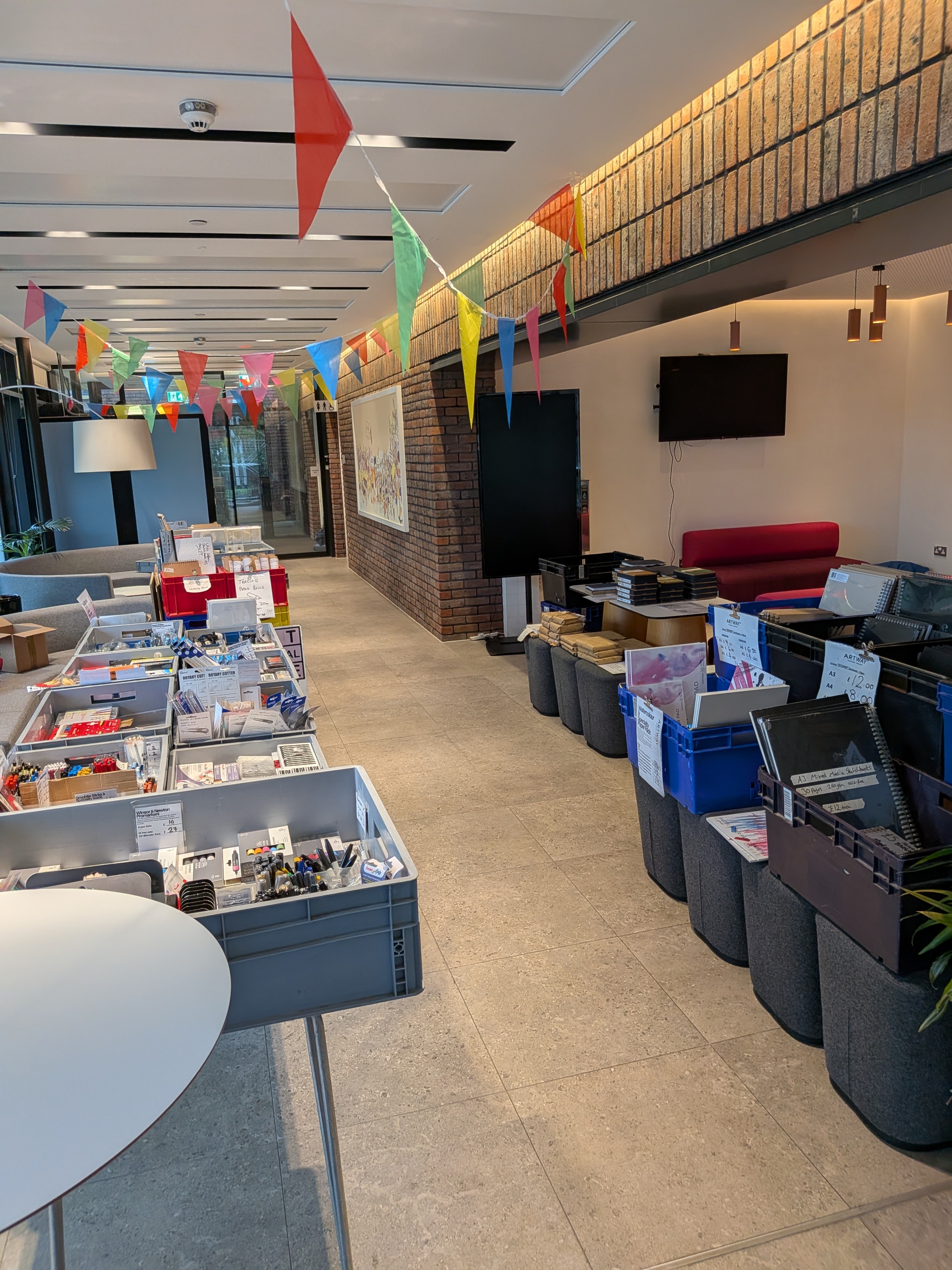 Artway stall with colourful bunting in an open space
