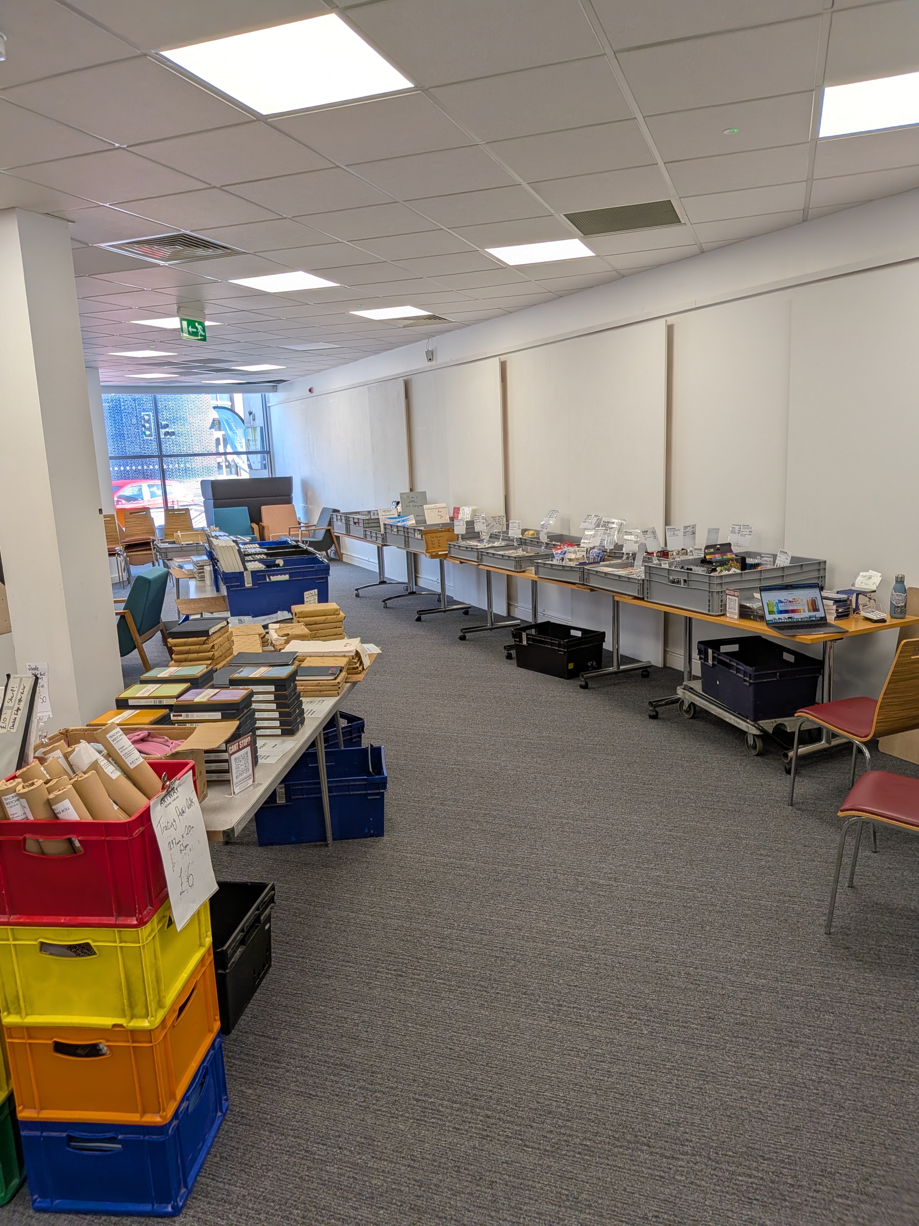 Long run of Artway stall tables with art supplies