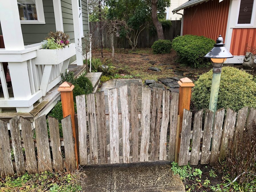 4x4 Traditional Miterless wood post caps with copper pyramids at a garden gate