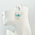 Cushion-cut Blue Topaz with Carved Serpentine Flower Drop Earrings