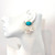 Oval Turquoise and Carved Mother of Pearl Flower Drop Earrings