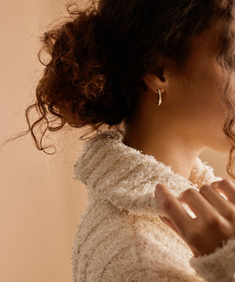 Model wearing Golden Titanium 20mm Brilliance Curved Pendant