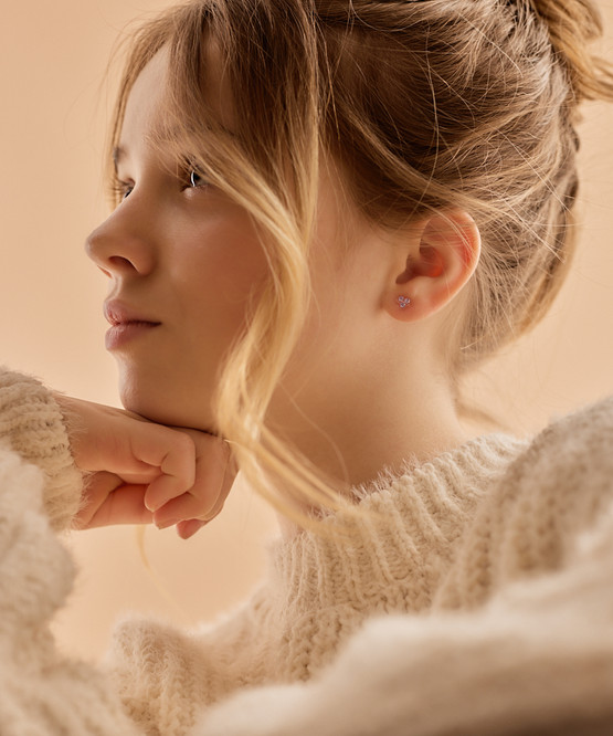Model Wearing Medical Plastic Clover Earrings in Violet